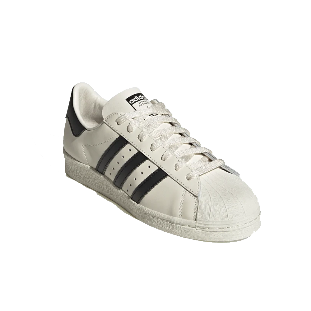 Adidas blancas y negras discount hombre